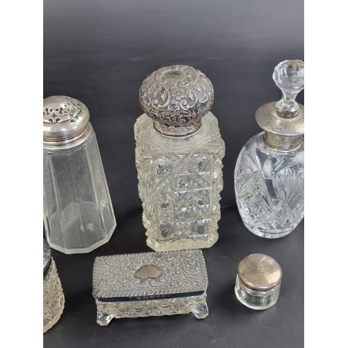 110 - Eleven silver and white metal mounted glass items.