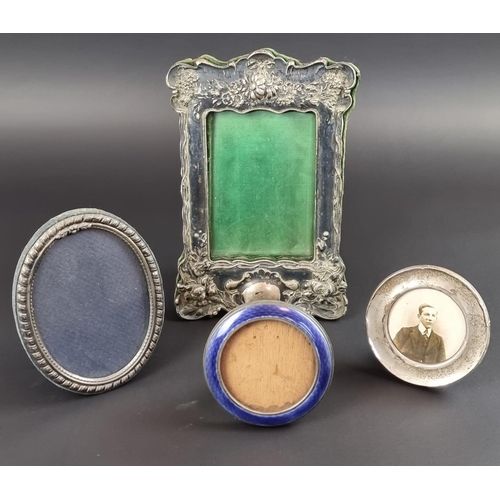 119 - Four silver mounted photograph frames; to include a guilloche enamel inlaid example. (4)... 