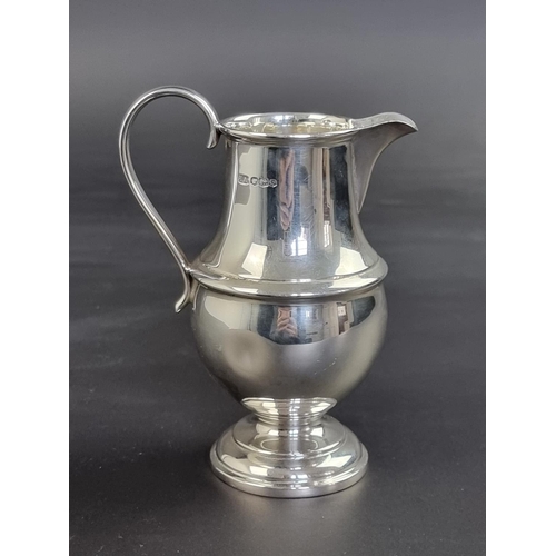 12 - A silver milk jug, by Atkin Bros, Sheffield 1948, 13.5cm high, 155g.