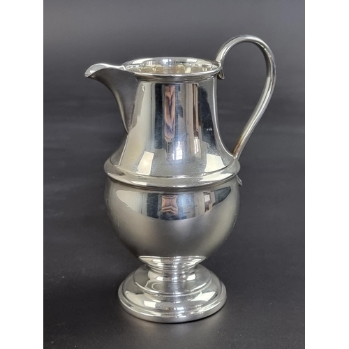 12 - A silver milk jug, by Atkin Bros, Sheffield 1948, 13.5cm high, 155g.