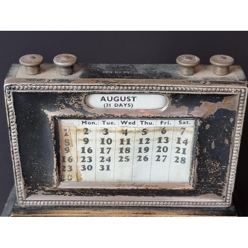 122 - A silver mounted quartz easel clock, by Keyford Frames Ltd, London 1990, 11.5cm high; together with ... 