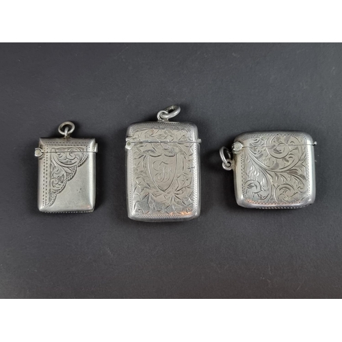 138 - A silver vesta case, by E J Partridge, 4.5cm high; together with two other silver vesta cases, ... 