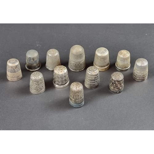 157 - Twelve silver thimbles, 57g.