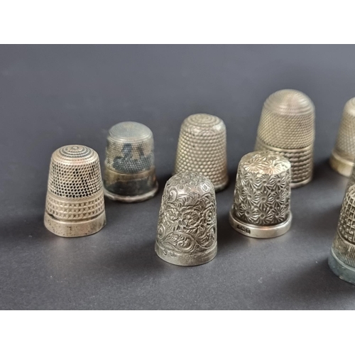 157 - Twelve silver thimbles, 57g.