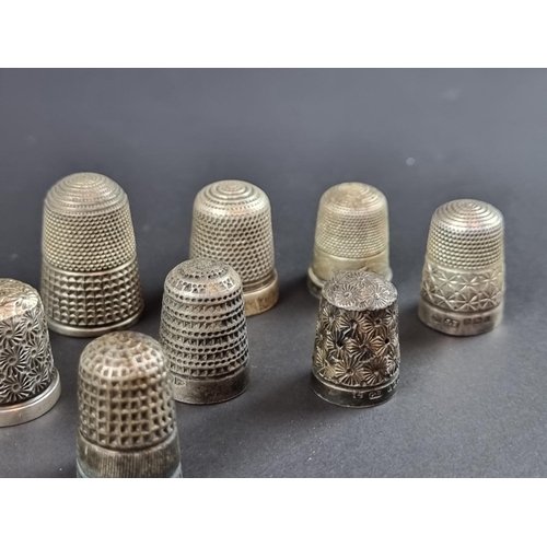 157 - Twelve silver thimbles, 57g.