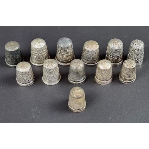 158 - Twelve silver thimbles, 46g.