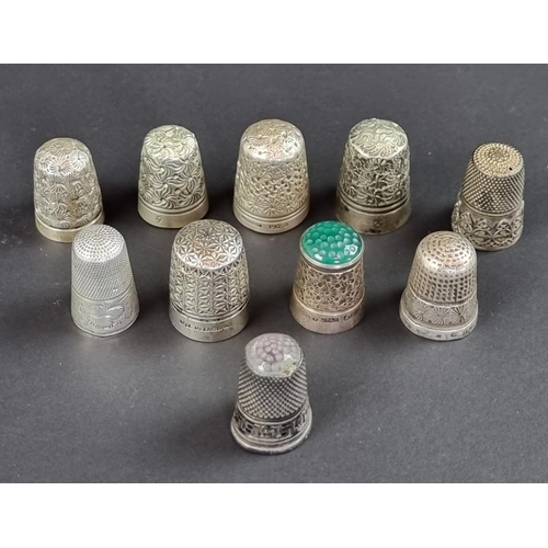 159 - A Georgian white metal thimble, marks rubbed, inscribed initials and dated '1824'; together with a c... 