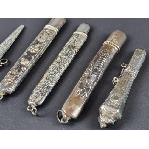 160 - Four white metal pendant bodkin cases, stamped 'Sterling'; together with another similar bodkin case... 