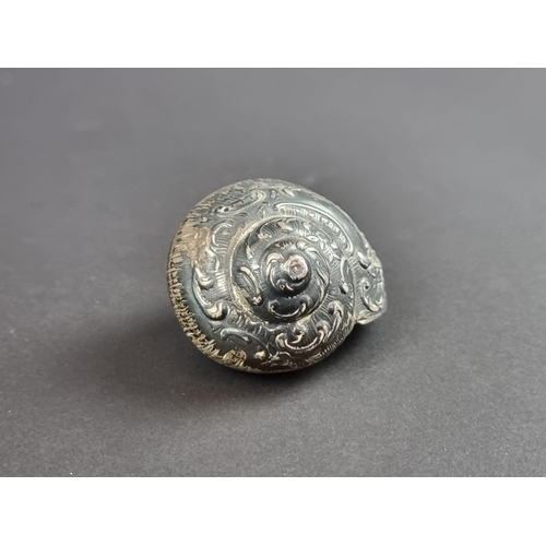 165 - A white metal novelty snail box; together with a silver buckle; and a silver mounted prayer book. (3... 