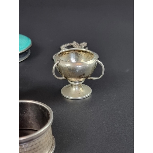 168 - A small quantity of silver items; together with a silver guilloche enamel lid; and a white metal ban... 