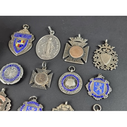 169 - Nineteen silver prize medals, gross weight 185g.