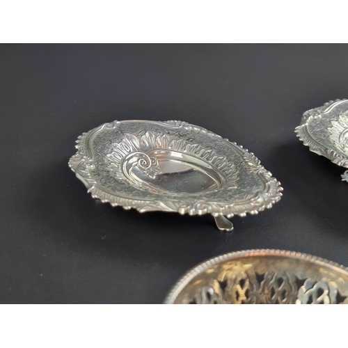 175 - A pair of Victorian silver salts, by M Bros, Birmingham 1894, 11cm wide; together with two silver di... 