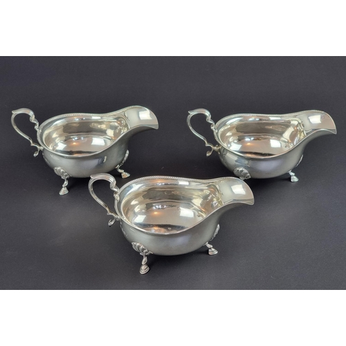 183 - A set of three silver sauce boats, by Adie Brothers Ltd, Birmingham 1923, height to handles 7.5cm, 3... 