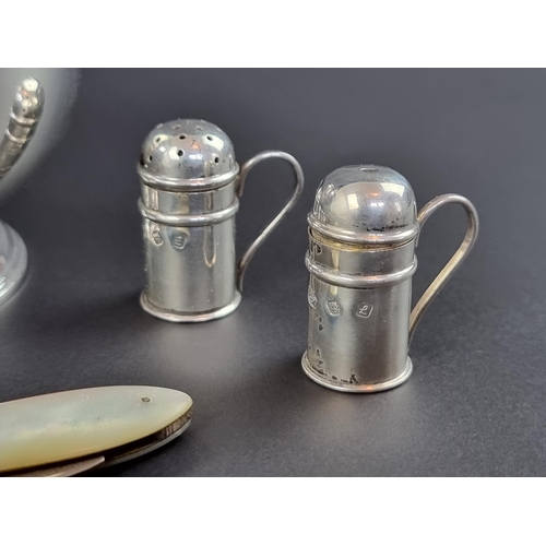 185 - Two pairs of silver bun peppers and salts, by J A Campbell, London 1988; together with a silver and ... 