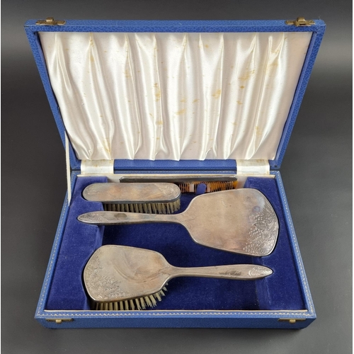 191 - A cased silver three piece dressing table set, by Henry Clifford Davis, Birmingham 1960.... 