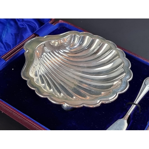 197 - A cased Edwardian silver shell butter dish, by James Dixon & Sons Ltd, Sheffield 1908, 12.5cm wi... 