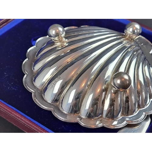 197 - A cased Edwardian silver shell butter dish, by James Dixon & Sons Ltd, Sheffield 1908, 12.5cm wi... 