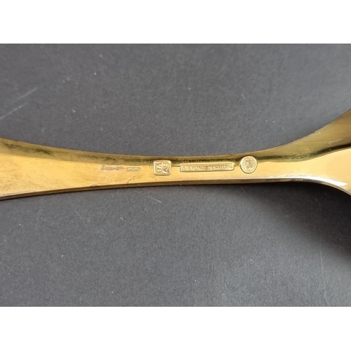 214 - A Georg Jensen silver gilt and enamel '1972' spoon, stamped 'Sterling Denmark, 925'.... 