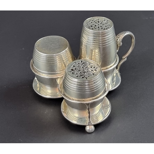 217 - A Victorian silver three piece barrel form cruet stand, by George Fox, London 1874, 195g.... 