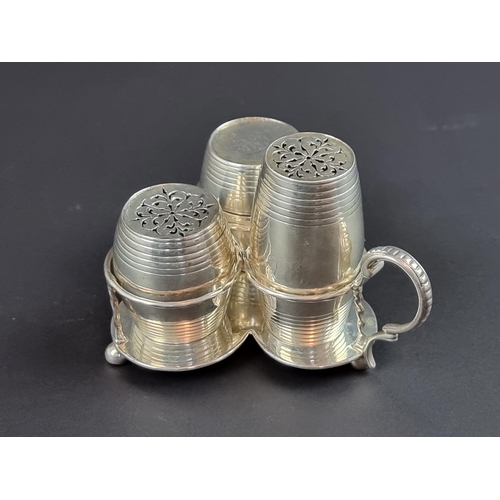 217 - A Victorian silver three piece barrel form cruet stand, by George Fox, London 1874, 195g.... 