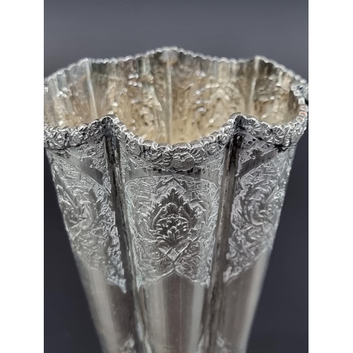 218 - A circa 1920 Persian fluted vase, stamped 84 and maker's mark to base, 17cm high.