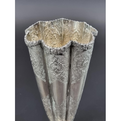 218 - A circa 1920 Persian fluted vase, stamped 84 and maker's mark to base, 17cm high.