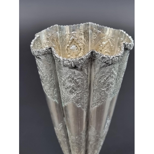 218 - A circa 1920 Persian fluted vase, stamped 84 and maker's mark to base, 17cm high.