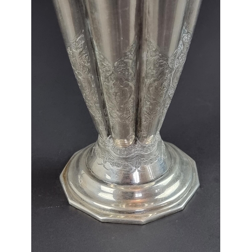 218 - A circa 1920 Persian fluted vase, stamped 84 and maker's mark to base, 17cm high.