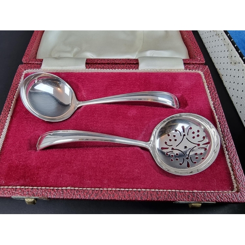 222 - A cased sugar sifter and matching ladle, by Francis Howard Ltd, Sheffield 1971; together with a case... 