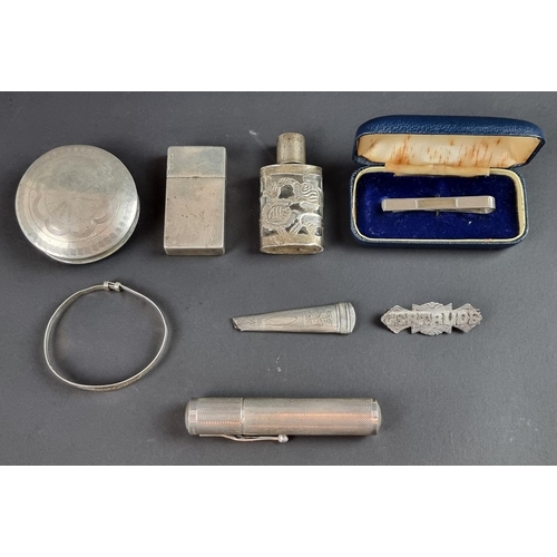 226 - A white metal mounted lighter, stamped 'Sterling Silver'; together with seven other silver, white me... 