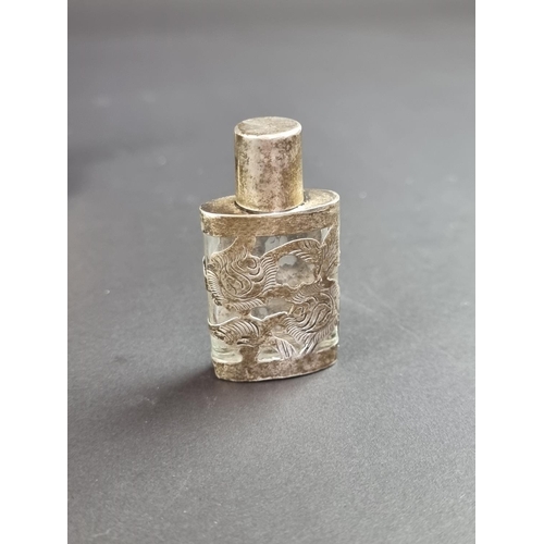 226 - A white metal mounted lighter, stamped 'Sterling Silver'; together with seven other silver, white me... 