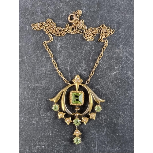 230A - An Art Nouveau yellow metal peridot and pearl pendant necklace, stamped '9ct', 37cm.... 