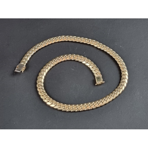 231 - A 9ct gold curb link necklace, import mark London 2000, 42cm, 83g, in a London Goldsmiths Company bo... 