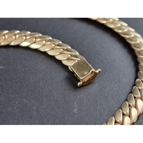 231 - A 9ct gold curb link necklace, import mark London 2000, 42cm, 83g, in a London Goldsmiths Company bo... 