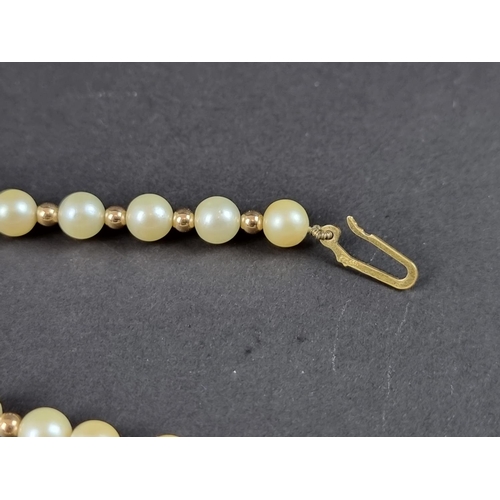 236 - A cultured pearl and gold bead necklace, with 9ct gold clasp, 42cm long.