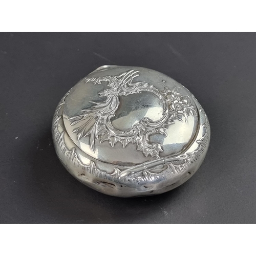 24 - A Continental white metal tobacco box, stamped '800', 7.5cm diameter.