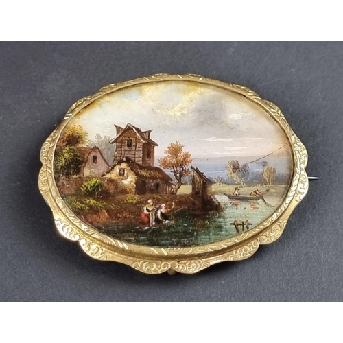 243 - A gold plated brooch, inset mother-of-pearl panel painted with anglers, 6cm wide.