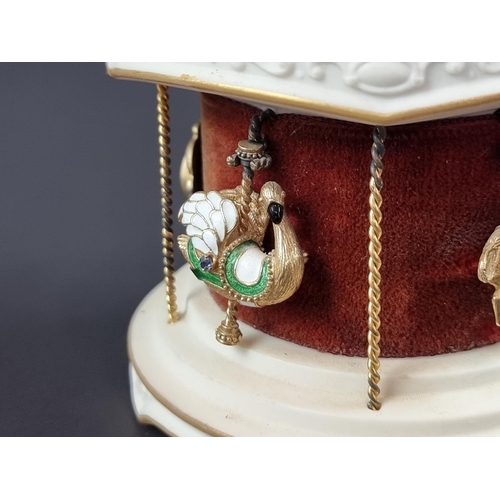 244 - An Igor Carl Fabergé for Franklin Mint 'The Jewelled Carousel', circa 1979, the white and gilt ceram... 