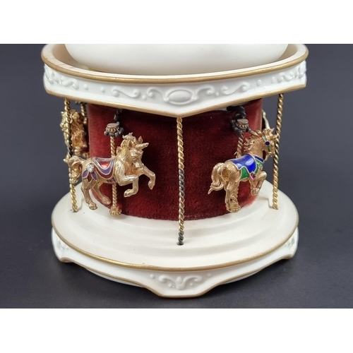 244 - An Igor Carl Fabergé for Franklin Mint 'The Jewelled Carousel', circa 1979, the white and gilt ceram... 