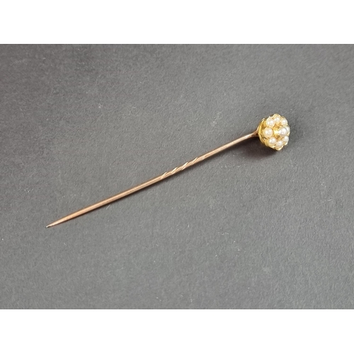 247 - A 19th century yellow metal stick pin, with floral cluster terminal set eight split pearls, cased.... 