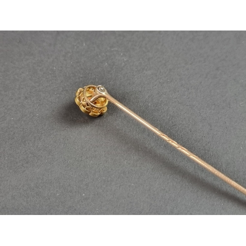 247 - A 19th century yellow metal stick pin, with floral cluster terminal set eight split pearls, cased.... 