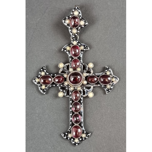 248 - A 19th century parcel gilt Bohemian pendant cross, having enamel decoration, set with cabochon garne... 