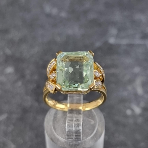 256 - An aquamarine and diamond ring, set rectangular cut cornered aquamarine with seven brilliant cut dia... 