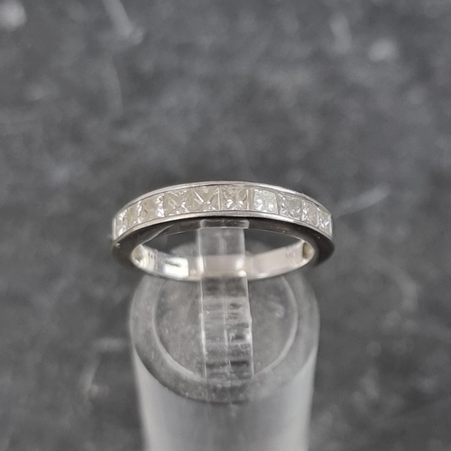 257 - An 18ct white gold diamond half eternity ring, channel set with ten square diamonds, size N, gross w... 