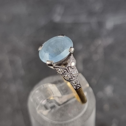 263 - An aquamarine and diamond ring, set faceted aquamarine with five diamonds to each shoulder, stamped ... 