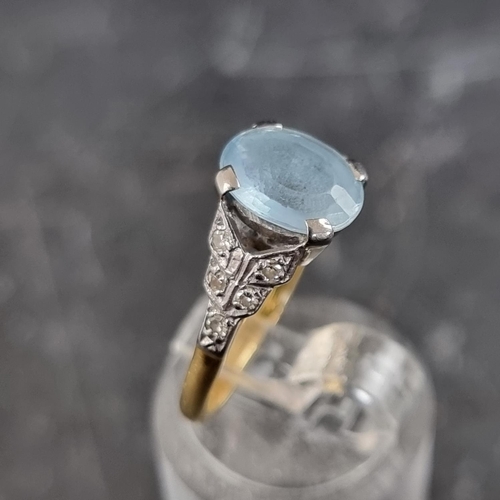 263 - An aquamarine and diamond ring, set faceted aquamarine with five diamonds to each shoulder, stamped ... 