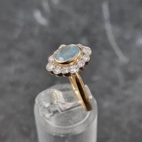 264 - An 18ct gold aquamarine and diamond oval cluster ring, by A P H, Birmingham 2003, size K, gross weig... 