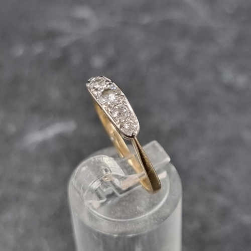 265 - A yellow metal diamond five stone ring, stamped '18ct', set central old cut diamond and four single ... 