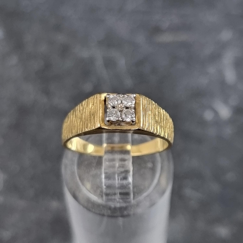 266 - A yellow metal diamond four stone ring, stamped '18ct', size L.