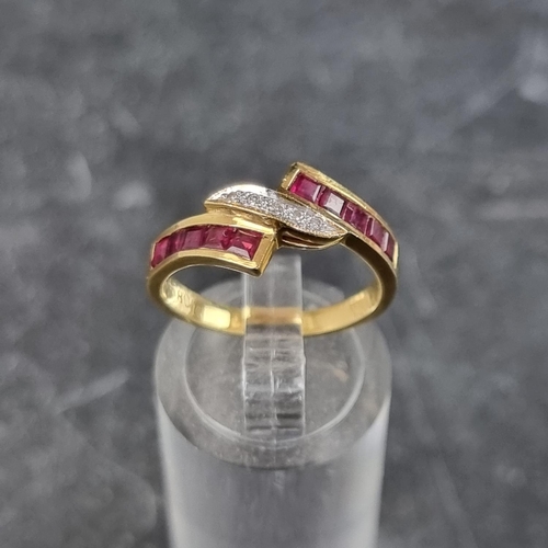 267 - A diamond and ruby crossover ring, set five brilliant cut diamonds to centre with a row of five pave... 